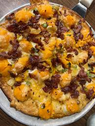 Pizza Lucé signature dishes Luce's Chicken Wings, Artichoke Dip, Baked Potato Pizza.
﻿